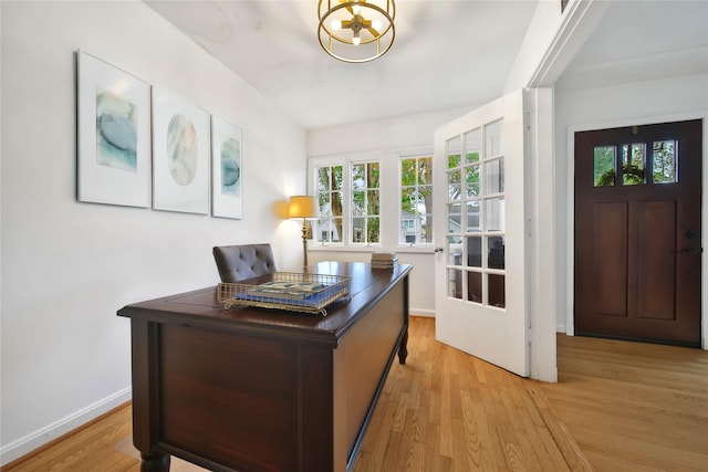 office with light wood-type flooring