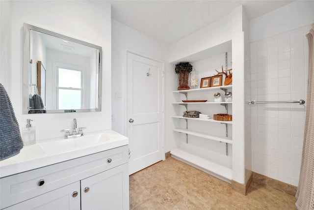 bathroom with vanity and walk in shower