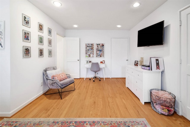 sitting room featuring light hardwood / wood-style flooring