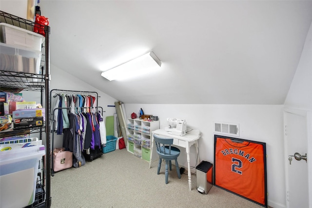 interior space featuring carpet and lofted ceiling