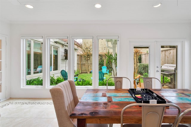 sunroom with a wealth of natural light and french doors