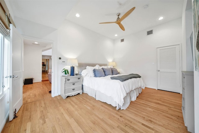 bedroom with light hardwood / wood-style floors and ceiling fan