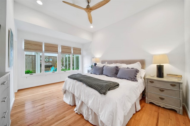 bedroom with ceiling fan and light hardwood / wood-style flooring