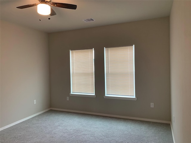 carpeted empty room with ceiling fan