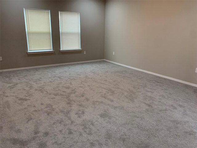 unfurnished room with carpet floors