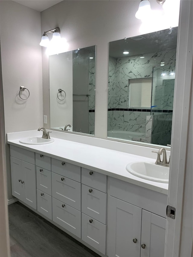 bathroom featuring vanity and hardwood / wood-style flooring