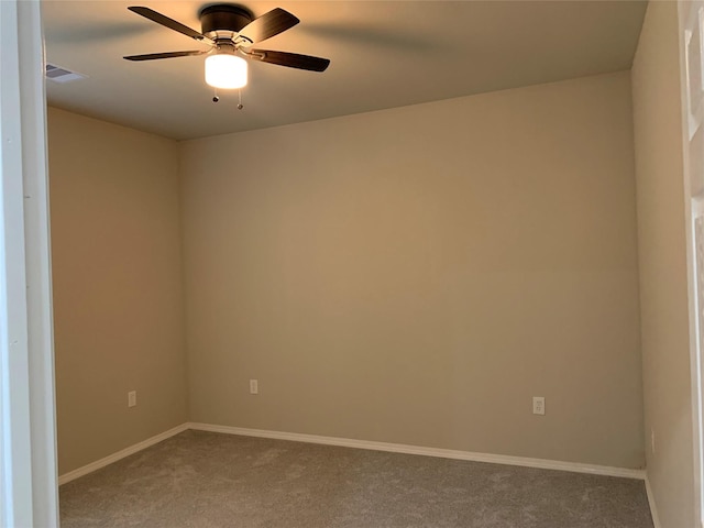 empty room featuring ceiling fan and carpet floors