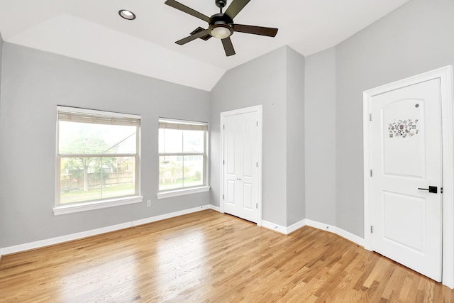 interior space featuring light hardwood / wood-style floors, ceiling fan, and lofted ceiling