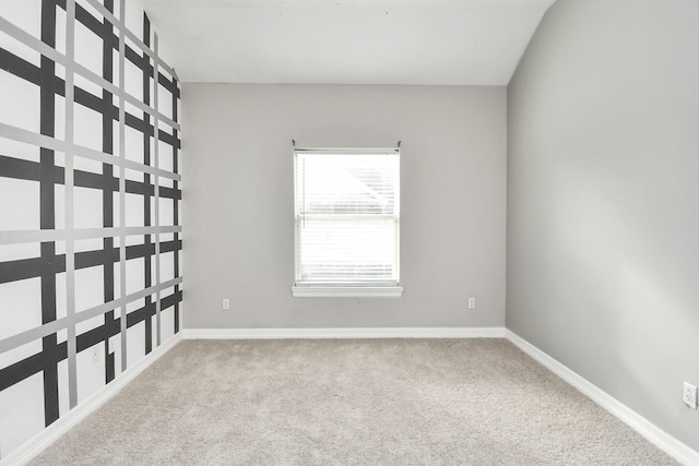 empty room featuring light carpet