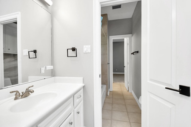 bathroom with tile patterned floors, vanity, and plus walk in shower