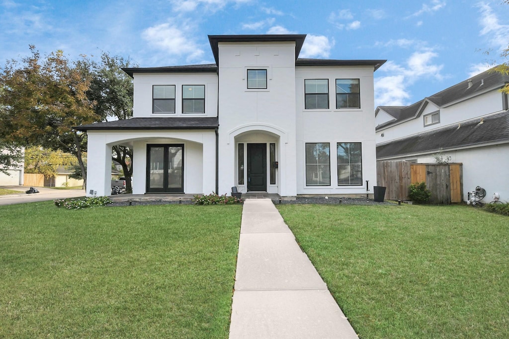 5601 Newcastle St, Bellaire, TX 77401 - view of front of property with a front yard and french doors