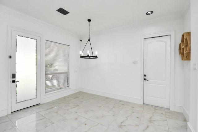 unfurnished dining area with ornamental molding and a notable chandelier