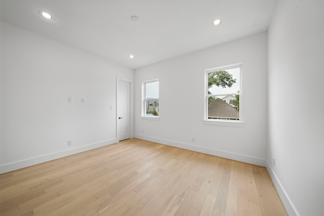 spare room featuring light hardwood / wood-style floors