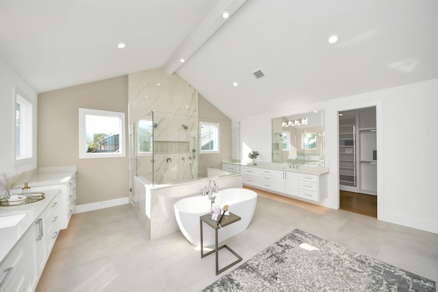 bathroom featuring vanity, lofted ceiling with beams, and independent shower and bath