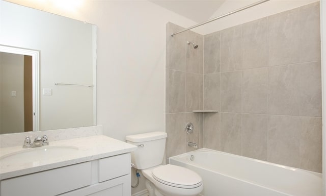 full bathroom with vanity, toilet, and tiled shower / bath