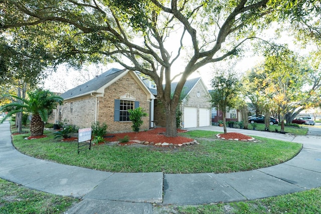 single story home featuring a garage and a front yard