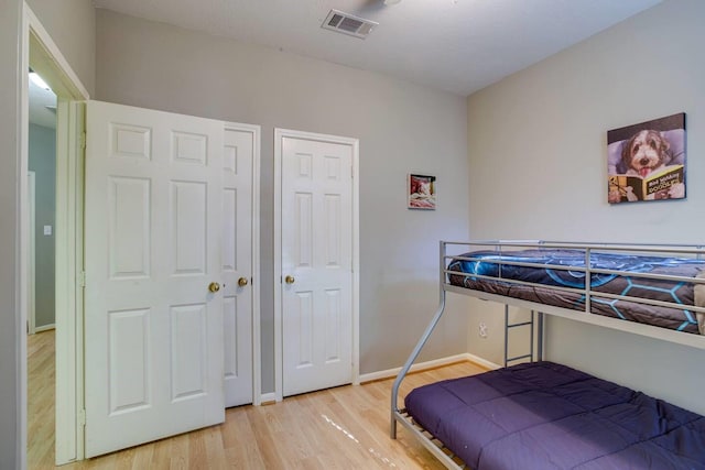 bedroom with hardwood / wood-style floors