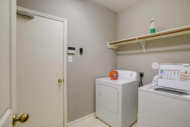 clothes washing area featuring independent washer and dryer