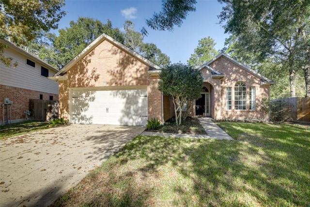 view of front of house with a front yard and a garage