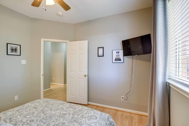 bedroom with light wood-type flooring and ceiling fan