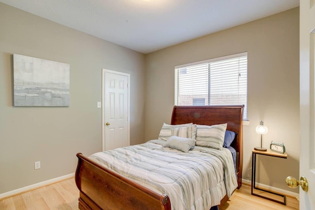 bedroom with light hardwood / wood-style floors