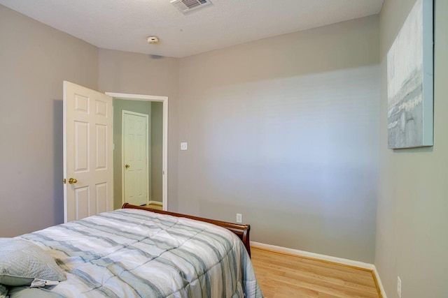 bedroom featuring hardwood / wood-style flooring