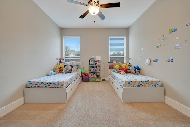 bedroom with light carpet and ceiling fan