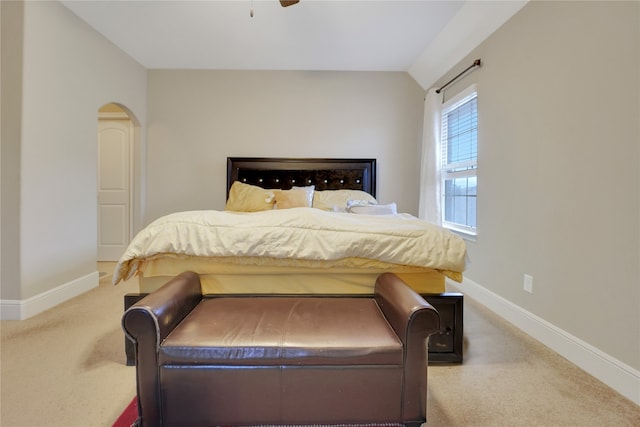 bedroom with light carpet and ceiling fan