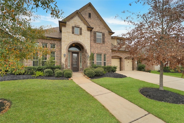 view of front facade featuring a garage and a front lawn