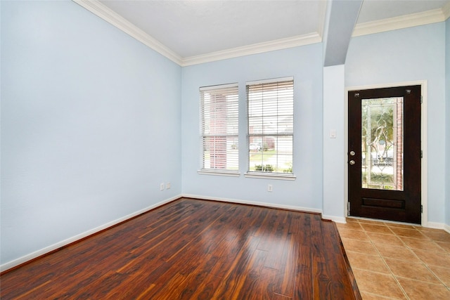 entrance foyer with wood-type flooring and crown molding