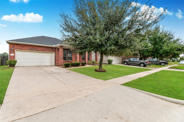 view of front facade with a front yard and a garage