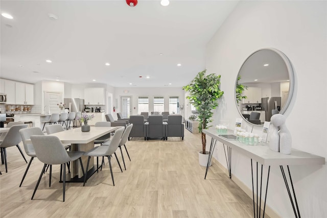 dining room with light hardwood / wood-style floors