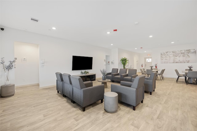 living room with light hardwood / wood-style floors