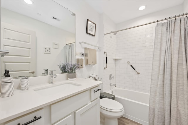 full bathroom featuring vanity, toilet, and shower / tub combo