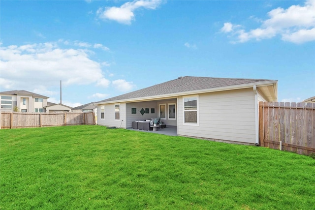 back of house featuring a lawn, an outdoor living space, and a patio