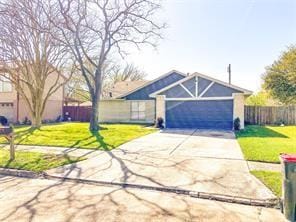 ranch-style house with a front yard and a garage