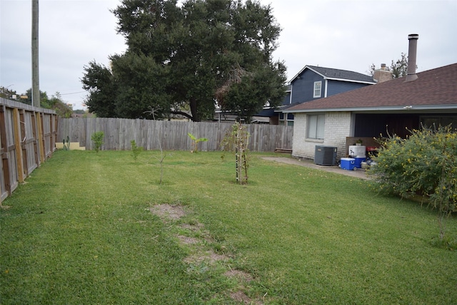 view of yard with central AC