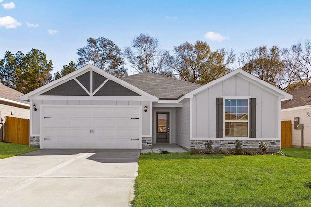 view of front of house with a garage and a front lawn