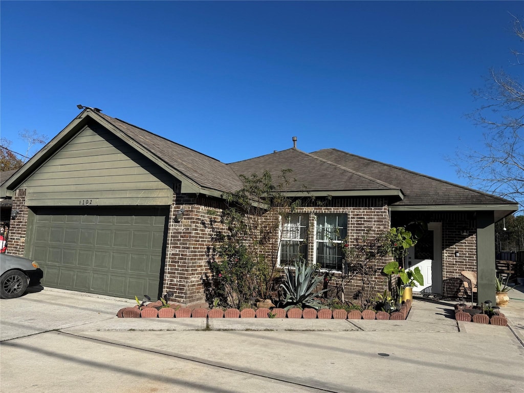 single story home featuring a garage