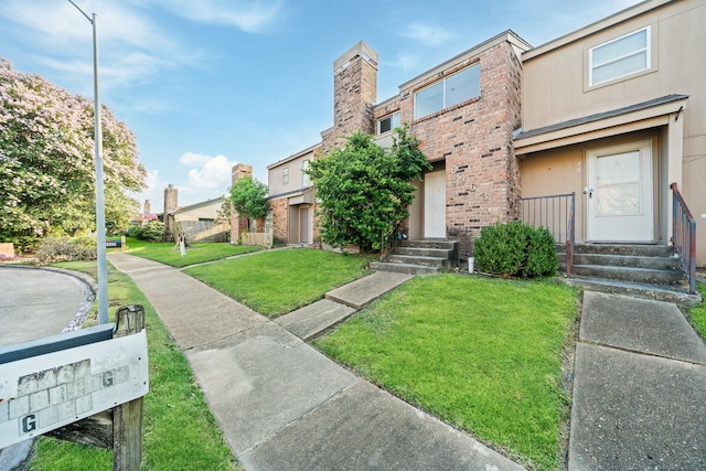 view of front of home with a front yard