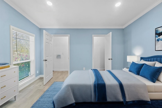 bedroom featuring light hardwood / wood-style flooring and ornamental molding