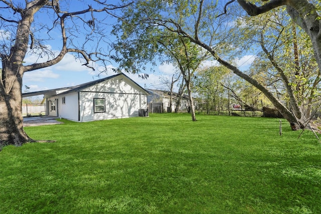 view of yard with central AC