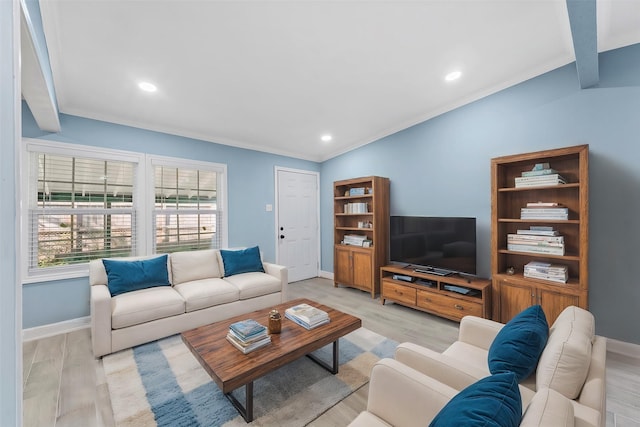 living room with lofted ceiling, light hardwood / wood-style floors, and crown molding