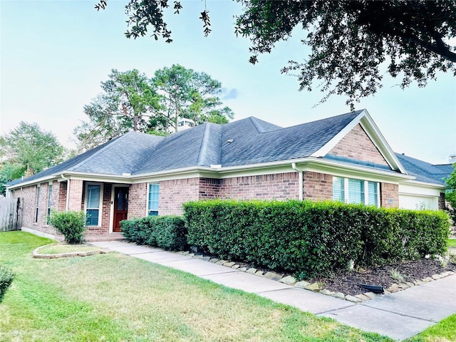 single story home featuring a front yard