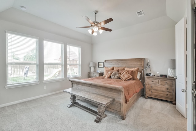 carpeted bedroom with ceiling fan and lofted ceiling