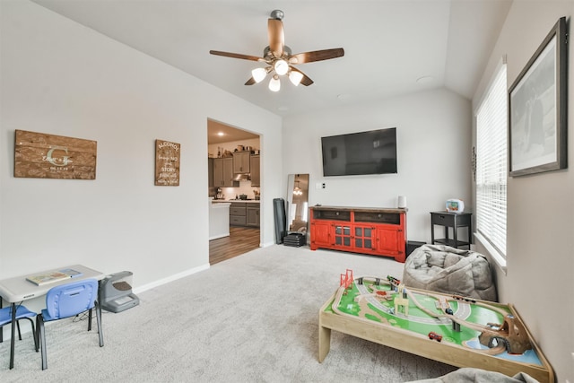 game room featuring carpet, ceiling fan, and vaulted ceiling