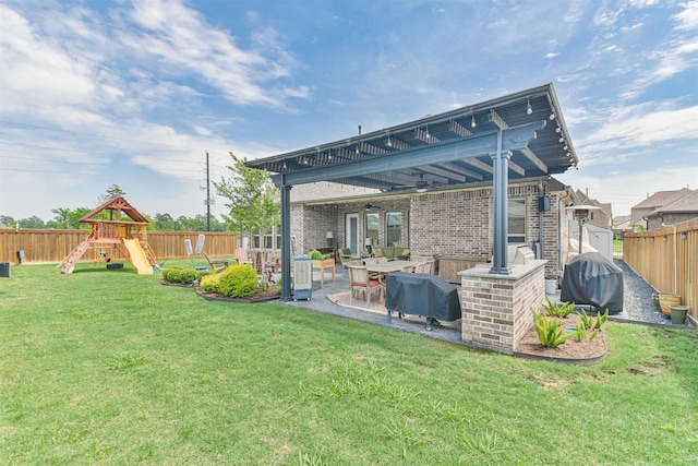 view of yard with a patio and a playground