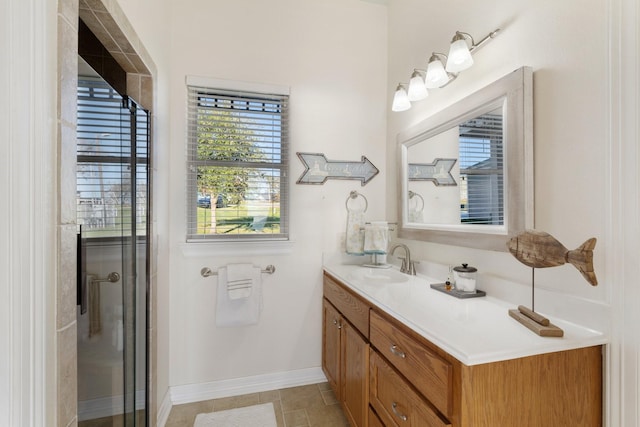 bathroom featuring vanity, tile patterned floors, and a shower with door