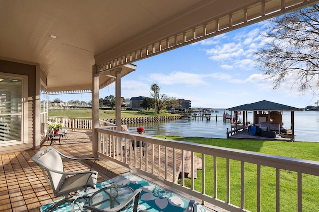 deck featuring a water view and a yard