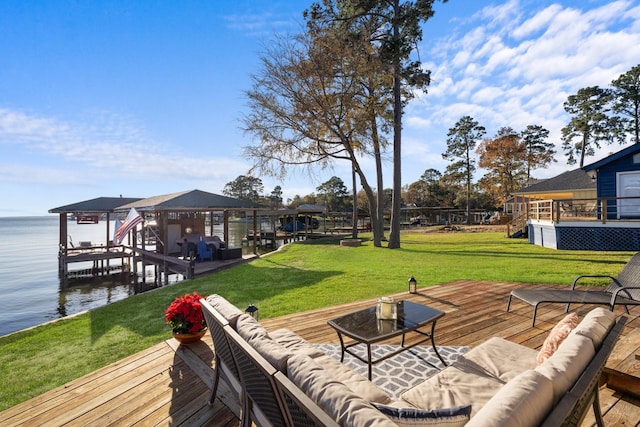 exterior space featuring outdoor lounge area, a gazebo, a yard, and a deck with water view